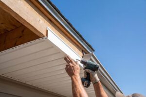 Siding contractor replacing exterior siding on a Washington home
